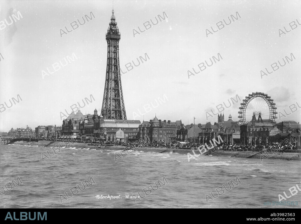 Blackpool Tower and the front, Blackpool, Lancashire, 1894-1910. A view looking north-east from the Central Pier towards Blackpool Tower with crowds of holidaymakers on the promenade. The tower was built in 1891-1894 by Maxwell and Tuke and was modelled on the Eiffel Tower in Paris.