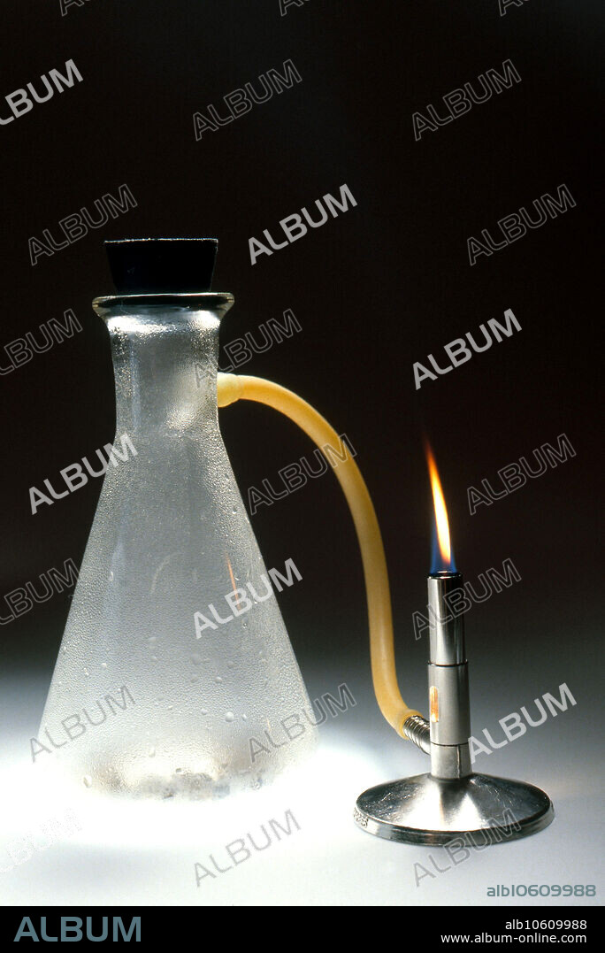 Calcium carbide (CaC2) reacting with water results in acetylene.