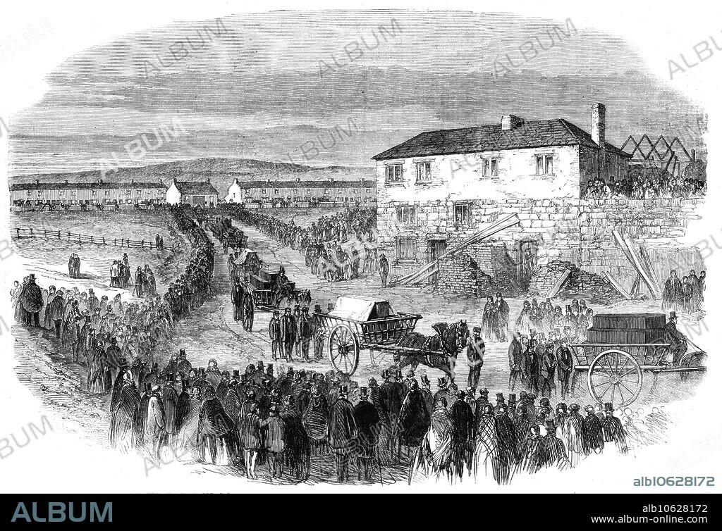 The New Hartley Pit Calamity: the funeral procession leaving Colliery Row for Earsdon Churchyard, 1862. The Hartley Colliery disaster of 16 January 1862 was a coal mining accident in Northumberland which resulted in the deaths of 204 men and children. '...there were probably 60,000 persons present...carts containing a layer of straw were slowly driven to the door of each cottage, and, amid the weeping and still more agonising signs of silent grief in every sorrowstricken house, the coffins were lifted over the side of the cart and packed in loads of five each...[by] three o'clock, nearly all the corpses had been taken to be interred in the quiet churchyard of Earsdon...Far as the eye could reach up and down the road one unbroken line of heavy-hearted mourners extended till lost in the distance...Round each cart were the immediate relatives of the deceased. All passed along in silence, with their eyes downward cast...along the route spectators had collected, watching, with serious faces and respectful attitude, the passage of the victims of an unparalleled calamity...the churchyard wall was broken through, that the coffins might be borne to the burying-ground through the churchyard...The house in the foreground is the Incumbent's residence'. From "Illustrated London News", 1862.
