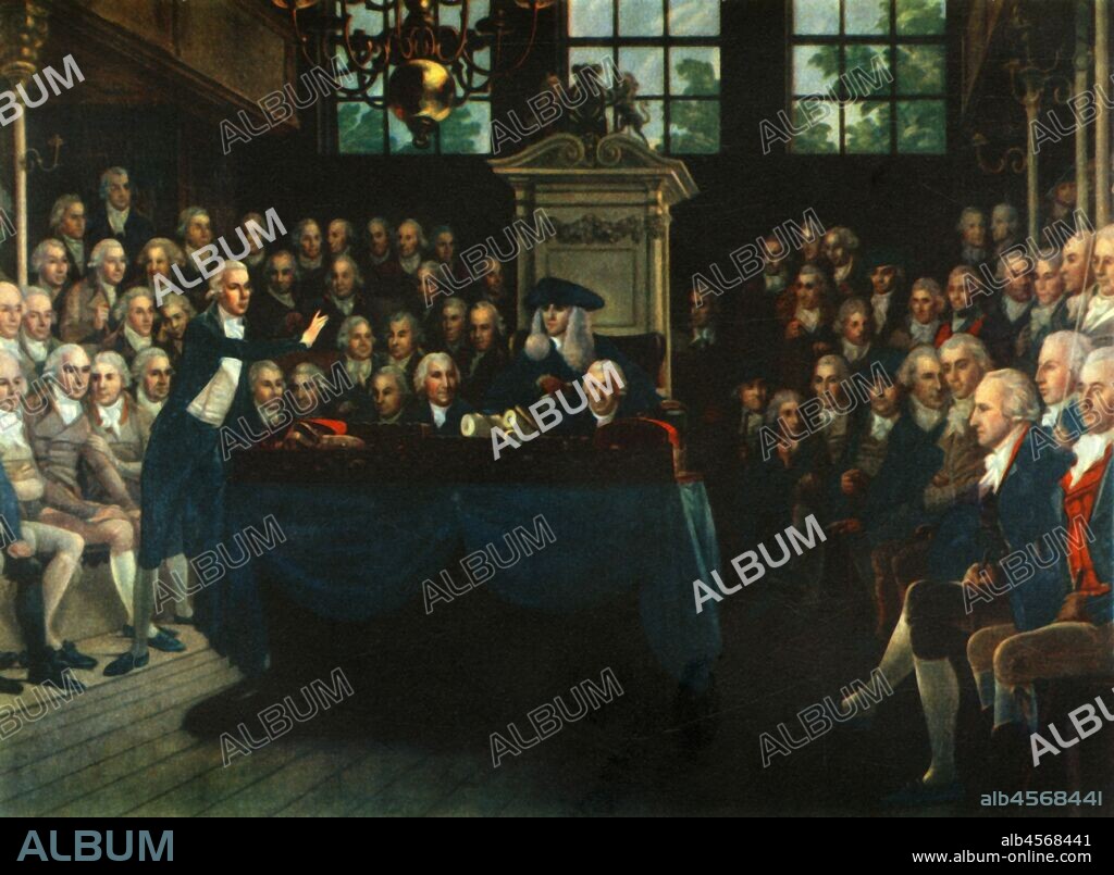 ANTON HICKEL. 'William Pitt, the Younger, Addressing the Commons', 1793, (1947). Session of parliament in the Palace of Westminster, London. Prime Minister William Pitt is on his feet. Charles James Fox is seated on the Opposition Front Bench. Speaker Henry Addington is in the Chair. 'The House of Commons 1793-94', a painting made 1793-1795, in the National Portrait Gallery, London. From "The House of Commons", by Martin Lindsay M.P. [Collins, London, 1947].