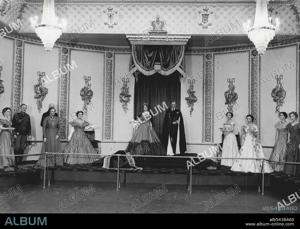 £10,000 Throng Room Setting For Tussaud's Waxwork effigies which will appear in a £10,000 Coronation year setting at famed Madame Tussaud's waxworks exhibition in London. In a reproduction of the throne room at Buckingham Palace are effigies of left to right): the Duchess of Gloucester; Duke of Gloucester; King Haakon of Norway; Queen Juliana; Duke of Netherlands; the Queen Mother; Queen Elizabeth; Duke of Edinburgh; Queen Ingrid of Denmark; Princess Margaret; the Duchess of Kent and the Princes.