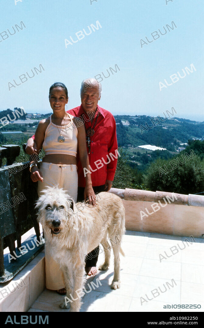 Actor Curd Juergens with his wife Margie and his Irish Wolfhound Rasputin in the summer vacation at Saint Paul de Vence, France 1978.