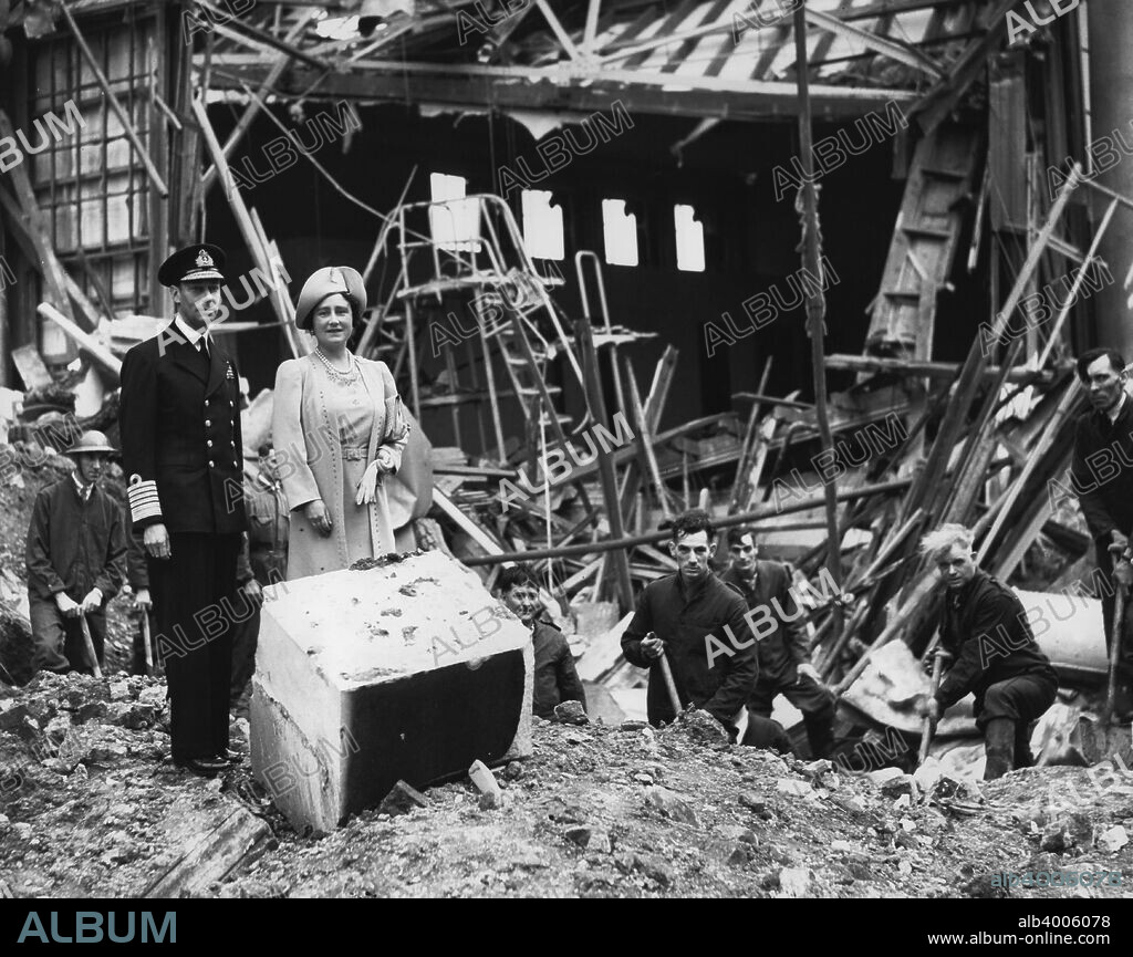 The King and Queen survey bomb damage, Buckingham Palace, London, WWII, 1940. King George VI and Queen Elizabeth looking at the aftermath of a German bombing raid on 11 September 1940 which destroyed the palace chapel. After the event the Queen famously said I'm glad we have been bombed. Now I can look the East End in the face. The palace was bombed on seven occasions during the war.