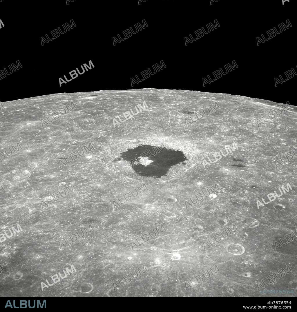 This is a view of the large crater Tsiolkovsky as photographed by the astronauts during the Apollo 8 lunar orbit mission, looking East toward the lunar horizon. Tsiolkovsky is approximately 150 statute miles in diameter.