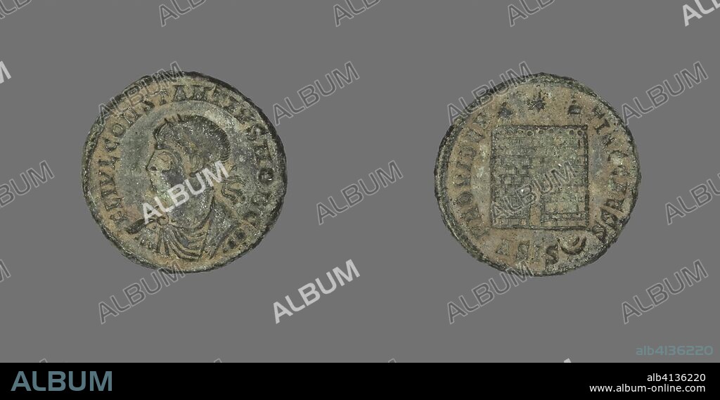ANCIENT ROMAN. Coin Portraying the Emperor Constantius I. Roman. Date: 250 AD-306 AD. Dimensions: Diam. 1.8 cm; 2.96 g. Bronze. Origin: Roman Empire.