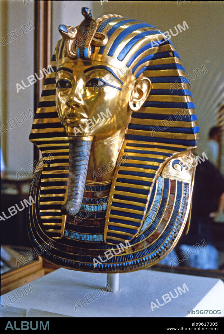 Tutankhamun death mask made of solid gold encrusted with precious stones, found by H. Carter in 1922.