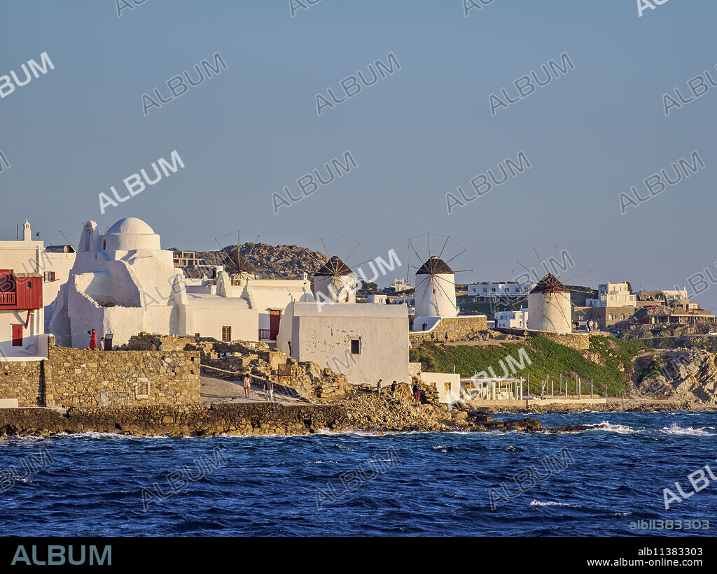 Church of Panagia Paraportiani and Windmills, Chora, Mykonos Town, Mykonos Island, Cyclades, Greece.