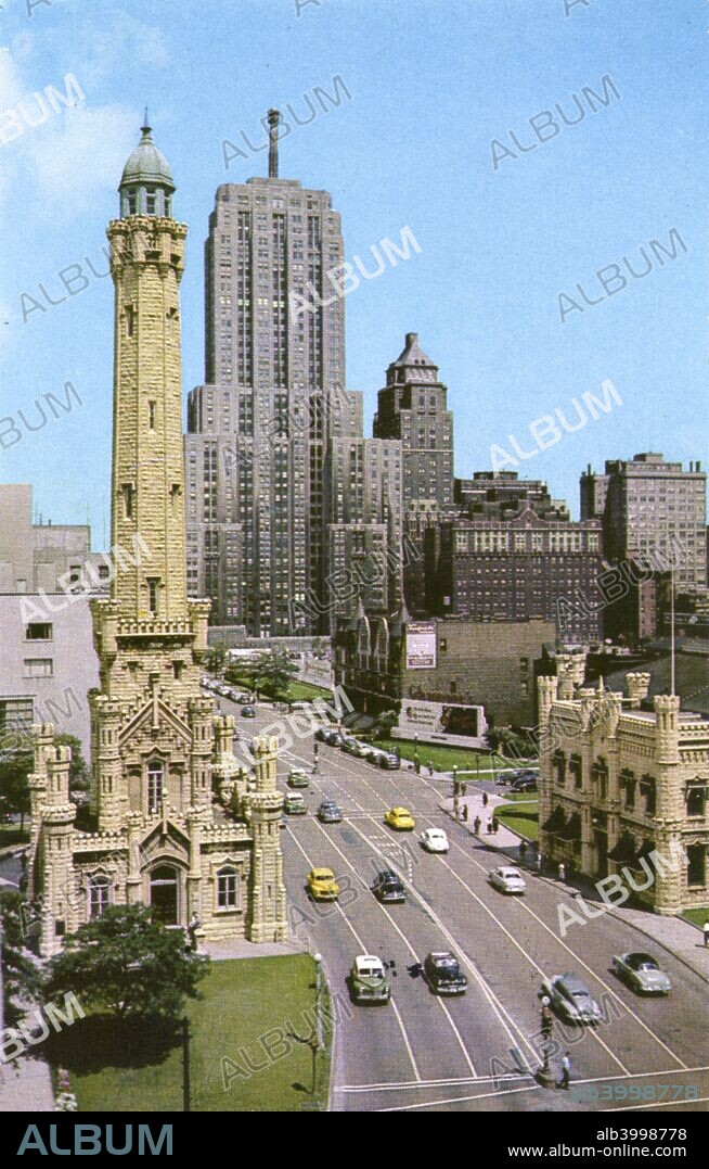 Michigan Avenue looking north, Chicago, Illinois, USA, 1950. Postcard. The Old Water Tower is in the left foreground. Cars and pedestrians are on the street. Designed by William W Boyington, the Chicago Water Tower was built in 1869 to hold water for firefighting. It was the only public building in the affected area to survive the Great Chicago Fire of 1871. Today it serves as a visitor centre for the Chicago Office of Tourism.