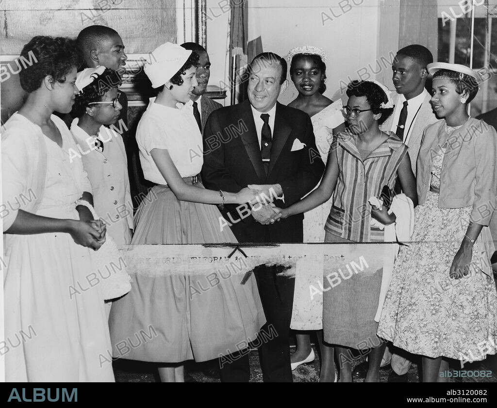 New York City Mayor Robert Wagner greeting the teenagers who integrated Central High School, Little Rock, Arkansas. Pictured, front row, left to right: Minnijean Brown, Elizabeth Eckford, Carlotta Walls, Mayor Wagner, Thelma Mothershed, Gloria Ray, back row, left to right: Terrance Roberts, Ernest Green, Melba Pattilo, Jefferson Thomas.
