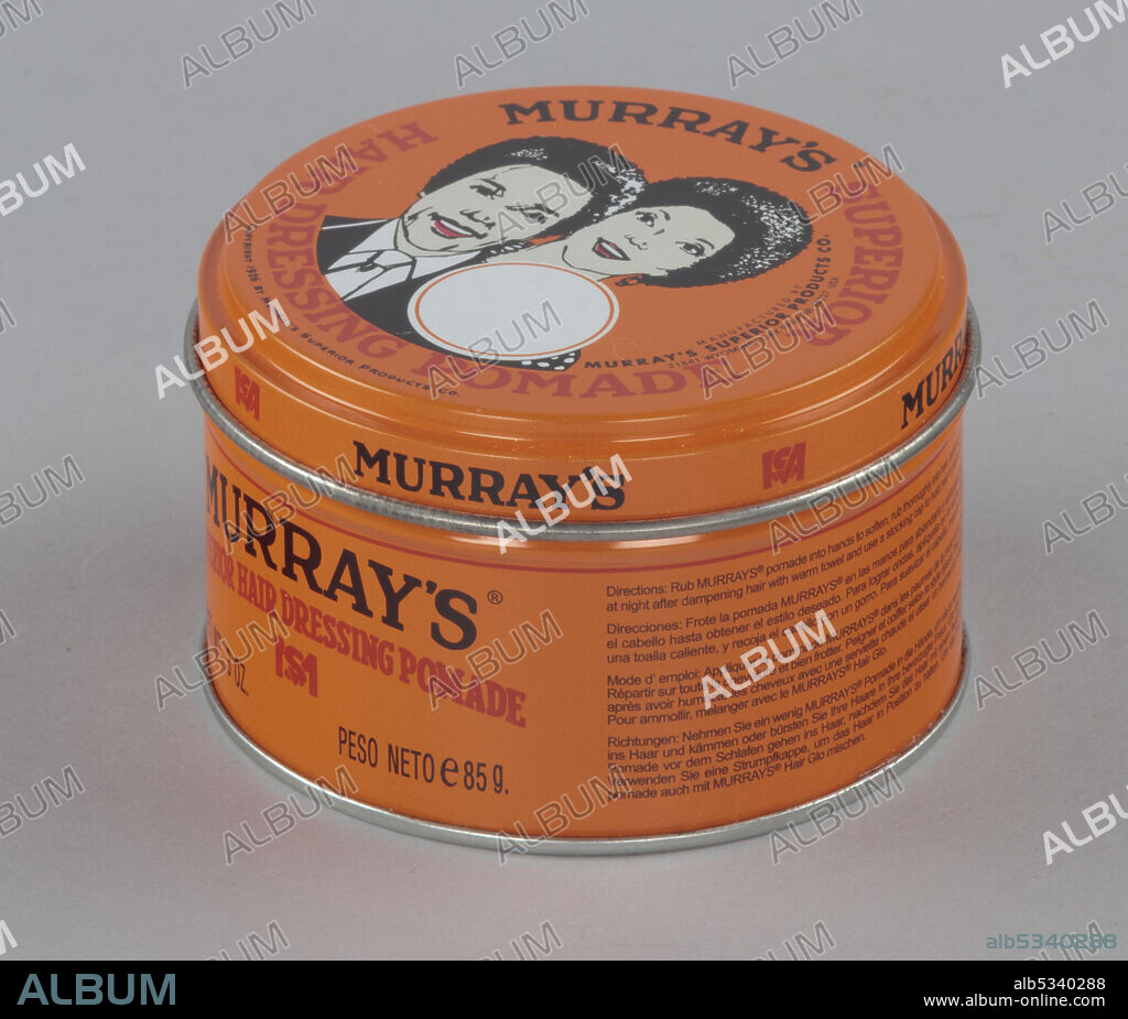 African-American barber C.D. Murray invented Murray's Superior Hair Dressing Pomade and began to sell it out of his Chicago barbershop. He founded Murray's Superior Products Co. in 1925, and the company expanded to produce a variety of hair care products which are sold internationally. Round metal orange-coloured tin with image of a Black man and woman with afro hairstyles.