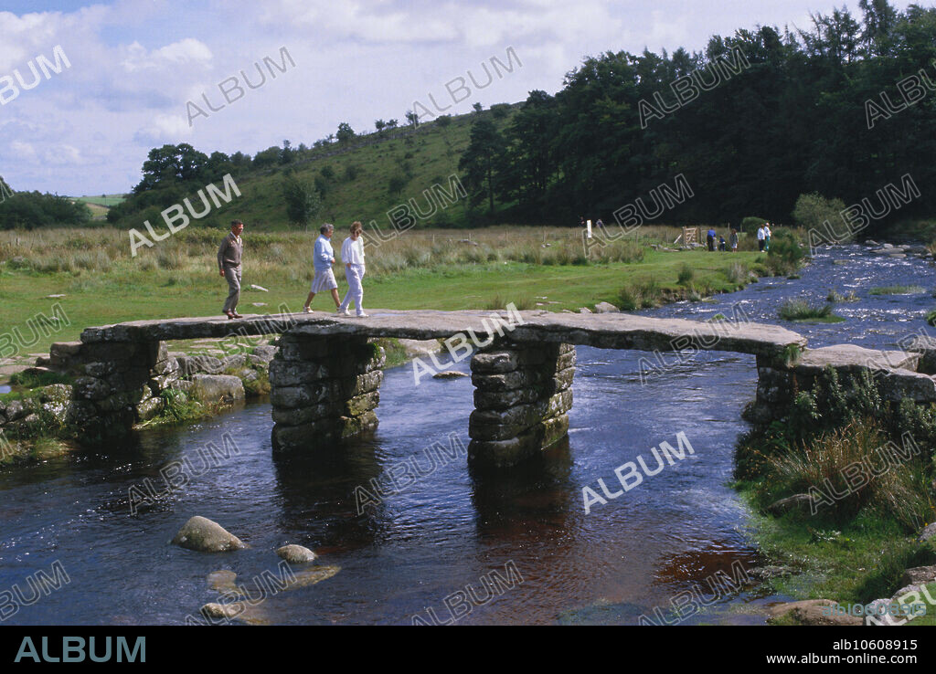 Postbridge or 'The Clapper Bridge' over East Dart River. Each granite slab is 8 tons. Built in the 13th century. Dartmoor National Park, Devon County, England.