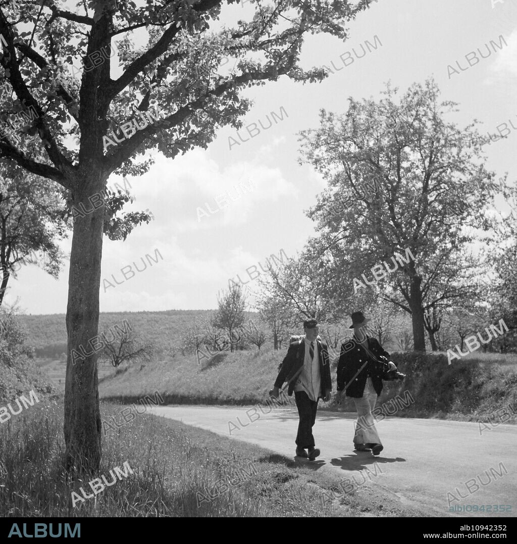 Travelling journeymen - carpenters - taking to the road through Germany, 1930s.