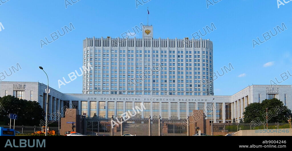 The White House or House of the Government of the Russian Federation, is a government building in Moscow. It stands on the Krasnopresnenskaya embankment. The building serves as the primary office of the government of Russia and is the official workplace of the Russian Prime Minister. The architects Dmitry Chechulin and Pavel Shteller designed the White House, originally called The House of Soviets. The overall design follows Chechulin's 1934 draft of the Aeroflot building. Construction started in 1965 and ended in 1981. Following the completion of the building in 1981, the Supreme Soviet of Russia, used the White House. The Supreme Soviet of Russia remained in the building until the end of the Soviet Union in 1991, as well as during the first years of the Russian Federation. In 1991 the Soviet Union issued a 50-kopeck stamp depicting the White House and honouring resistance to the 1991 Soviet coup d'etat attempt.