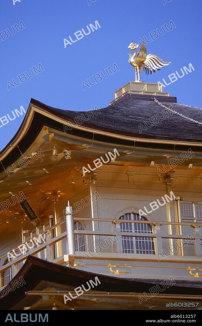 JAPAN Honshu Kyoto Kinkaku Ji Temple aka the Golden Pavilion. Section of the gold leaf covered structure and rooftop bronze phoenix.