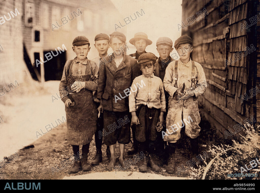 Group of Young Boys, ages 7 to 12, working as cutters at Seacoast Canning Company, Eastport, Maine, USA, Lewis Wickes Hine, August 1911.