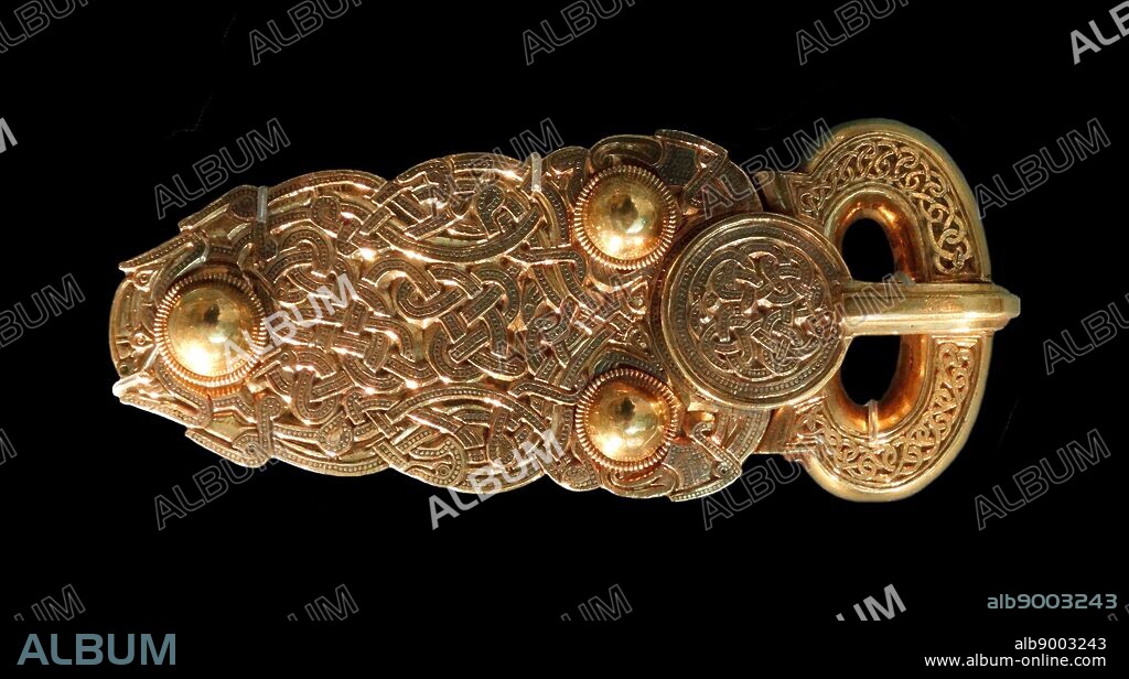 Sutton Hoo buckle or Great gold buckle. Anglo-Saxon, early 7th century AD masterpiece of early medieval craftsmanship. with curved sides and three domed bosses resembles Frankish buckles.