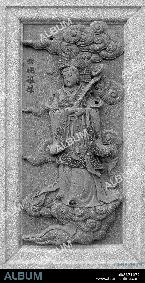 Nuwa, sometimes also known as Nugua, is an ancient Chinese goddess who is most famous for the creation of mankind and repairing the pillar of heaven. She is often depicted as either a woman with a serpentine lower body or even just a woman's head on a serpent's body, earning her the name 'Snake Goddess'. Nuwa and her brother/husband Fuxi forged humanity out of clay, breathing life into them.<br/><br/>. After a fight between the fire god Zhurong and the sea monster Gong Gong caused the latter to smash into Buzhou Mountain, one of the pillars holding up the sky, which resulted in calamity. Great floods and much suffering affected the people, and Nuwa is said to have cut the legs off the giant turtle Ao, using them in place of the fallen pillar to end the disaster. However, she was not able to fully correct the tilted sky and earth, thus explaining why Chinese rivers generally flow to the southeast while the sun, moon and stars move towards the northwest.<br/><br/>. Nuwa also plays an important role in the Ming Dynasty novel 'Fengshen Yanyi'. After King Zhou of Shang Dynasty insulted the goddess by lusting after her and writing an obscene poem on the wall of her temple. In vengeance, she sent three spirits to bewitch King Zhou, eventually causing the downfall of the Shang Dynasty.