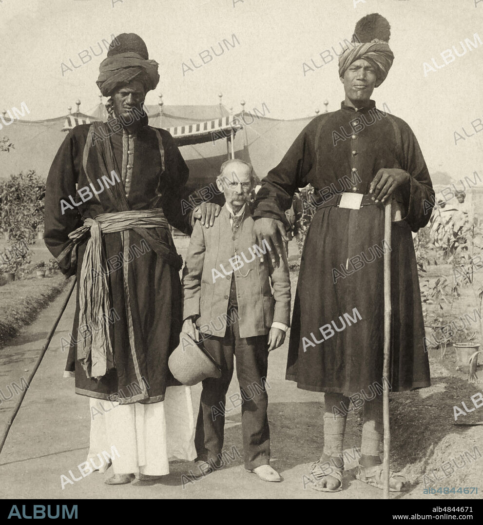 Victorian Stereoview card from circa 1900 India through the stereoscope.1903. Professor Ricalton and two of his big Cashmere friends at the Durbar,Delhi,India.