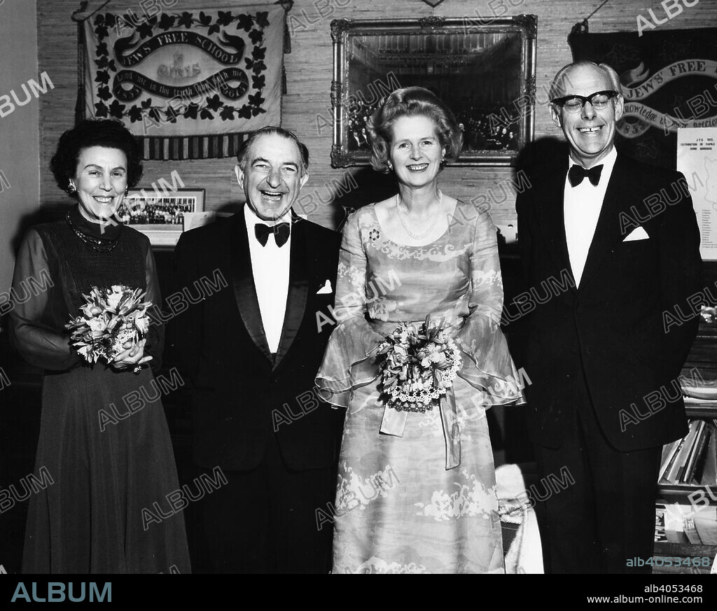 Margaret Thatcher (1925- ), Denis Thatcher (1915-2003), Dr and Mrs Conway at JFS. comprehensive school parent teacher association ladies' night, 1975.