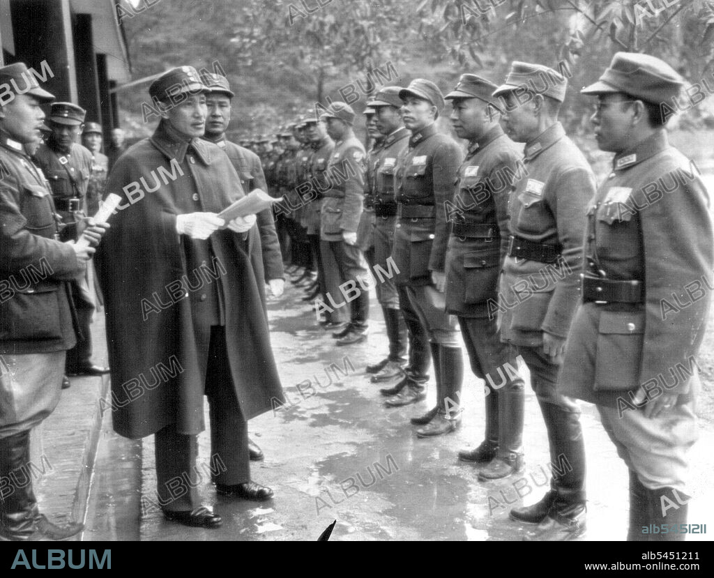 The Generalissimo Addresses His Troops - China's Generalissimo Chiang Kai-Shek (wearing cape) addresses some of his troops during visit last month to Kwangsi province where Chinese soldiers are being trained under American direction. March 27, 1944. (Photo by AP Wirephoto).