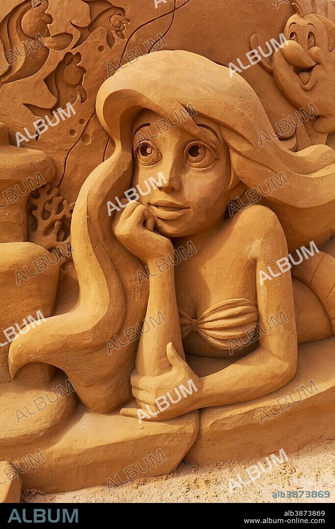 Woman with long hair, sand sculpture, mermaid from the Disney cartoon Arielle sand sculptures festival Frozen Summer Sun, Oostende, West Flanders, Belgium