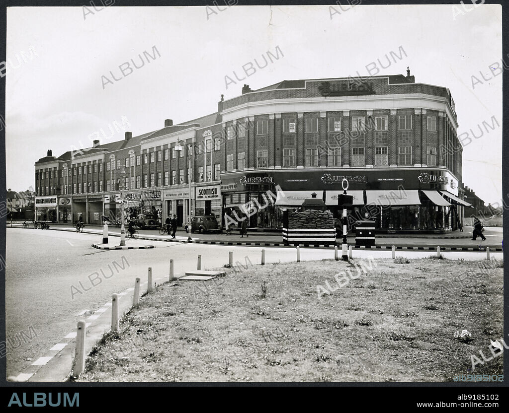 HEALEY AND BAKER. 553-573 Kingsbury Road, Kingsbury, Brent, Greater London Authority, 1939-1950. Exterior view from the north-west of the shopping parade at 553-573 Kingsbury Road.
