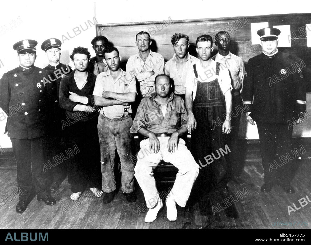 Crew Of British Schooner "I'm Alone" After Sinking Of Vessel. -- Members of the crew of the sunken British schooner "I'M Alone", as they appeared in this city to which they were taken following their capture by the coast guard cutter "Dexter". Left to right are, officers Colletti, Williams, members of crew E. Fouchard, E.Young, J. Williams. James Barrett Capt. Randall, Peter Jansen, C. Hobbs, Wm. Wordsworth and Corp. Peter Burges. March 26, 1929. (Photo by International Newsreel Photo).