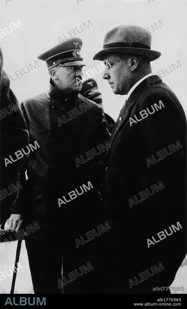Adolf Hitler with Martin Bormann. The German Chancellor Adolf Hitler posing next to the Nazi hierarch Martin Bormann. Germany, 1945.