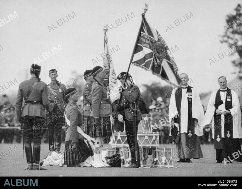 Prince of Wales presents NEW Colors to Seaforth Highlanders
The Prince of Wales presented new colors to the 2nd Battalion of the Seaforth Highlanders - the Prince being the Colonel-in-Chief, at Dover today, July 5, at the Duke of Yorks Military School.
The Prince of Wales presenting new colors to the highlanders today, July 5. August 19, 1935. (Photo by The Associated Press).
