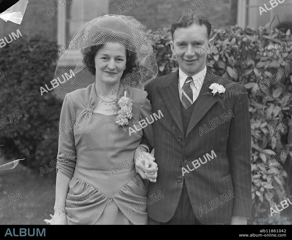 First Match Of The Season. The Surrey wicket-keeper A.J McIntyre was married to Miss Dorothy Benton at Epsom Register Office this morning (Saturday). Picture shows: A.J McIntyre and his bride pictured after their marriage at Epsom today (Saturday). 20th March 1948.
