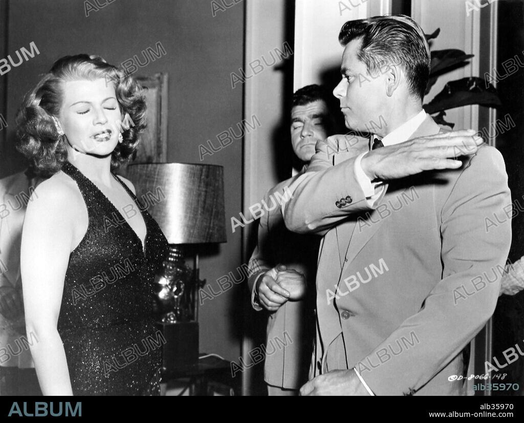 GLENN FORD and RITA HAYWORTH in AFFAIR IN TRINIDAD, 1952, directed by VINCENT SHERMAN. Copyright COLUMBIA PICTURES.