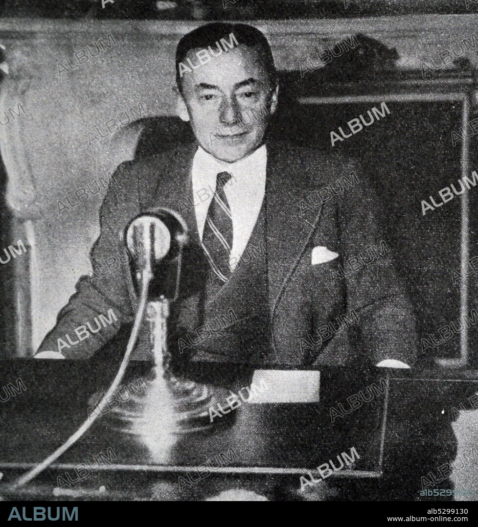 Black and white photograph of Paul Reynaud (1878-1966), French Finance Minister, giving a speech on the radio.