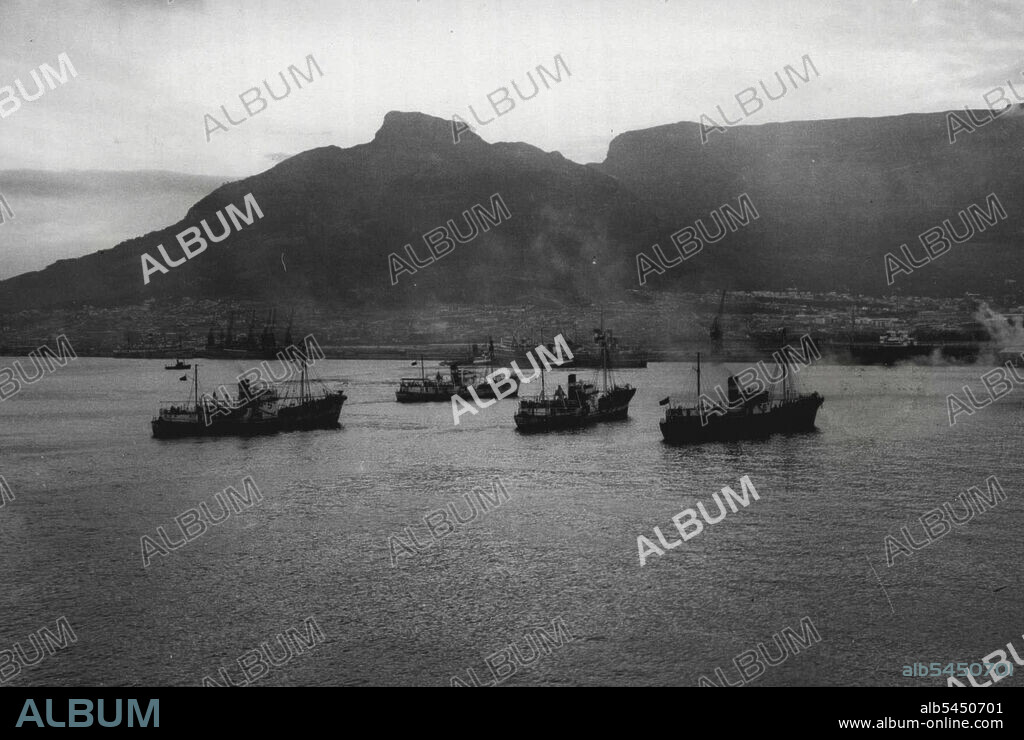 Russian Whaling Fleet Arrives at Cape Town.Photo shows : The Russian whaling fleet entering the harbour at Cape Town.The Russian Whaling Fleet- comprising the Parent ship "Slava" with eight "catchers" arrived at cape town to take on supplies. The expedition in on it's way to the Antarctic. Few cape town people had even seen a ship flying the Red Flag, as only three other Russian vessels had entered Tale Bay since the Soviet Republic was established 28 years ago. December 05, 1947. (Photo by Sports And General Press Agency Ltd).
