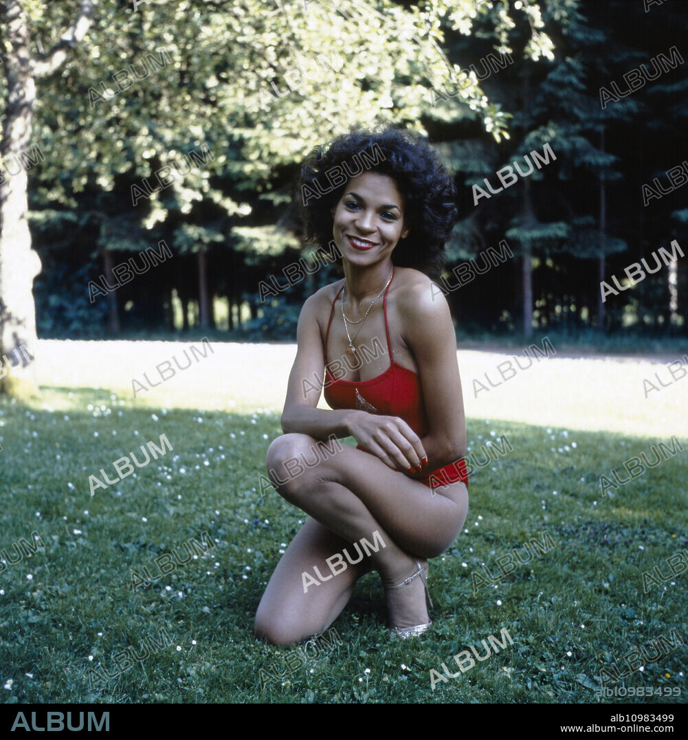Photo shooting with the German pop singer Ramona Wulf in a red bathing suit for the single "Shake What You'Mama Give Ya (1980)", Germany circa 1980.