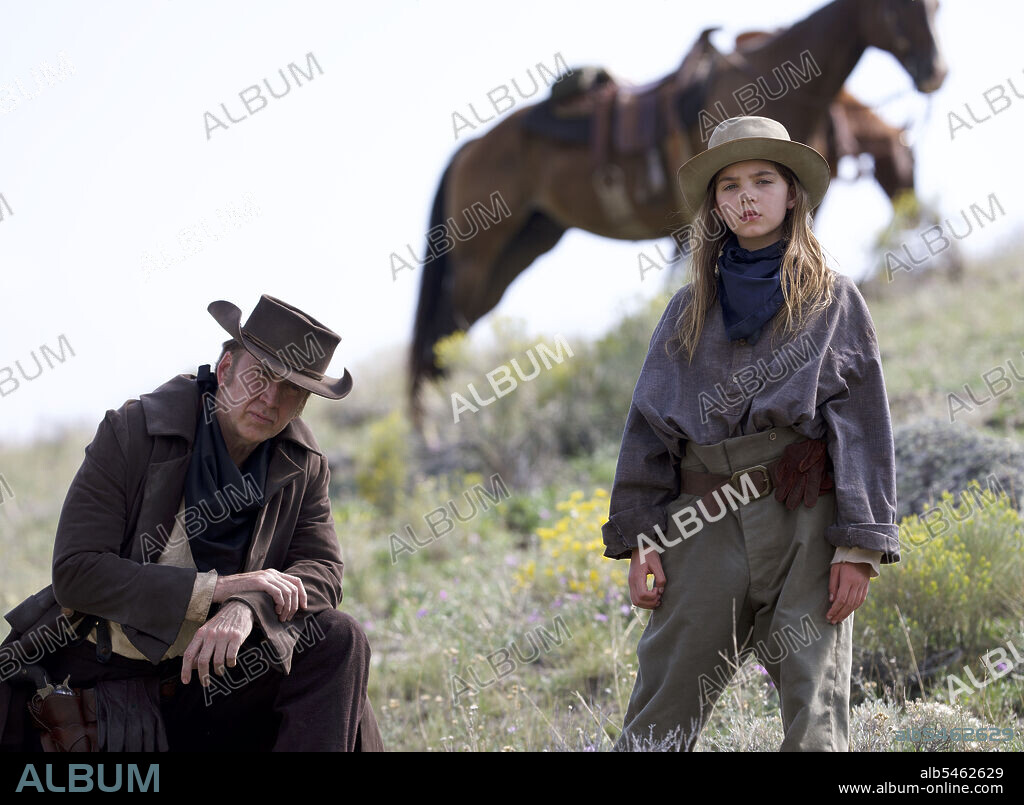 NICOLAS CAGE and RYAN KIERA ARMSTRONG in THE OLD WAY, 2022, directed by BRETT DONOWHO. Copyright Skipstone Pictures.