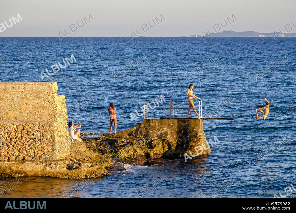 Pier diving board at sunset, Sa Rapita, Campos del Puerto, Mallorca, Balearic Islands, Spain.