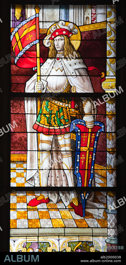 Germany, Cologne, Cologne Cathedral, North Aisle, Stained Glass Window, St. Peter and Tree of Jesse. Cologne Cathedral was built was built to house the relics of the Three Magi, under the direction of Archbishop Conrad von Hochstaden. Construction of the present Gothic church began in August 15th, 1248 and completed in 1880. In 1996, the cathedral was added to the UNESCO world heritage list of culturally important sites. The window depicts to the left, the archbishop Philipp with pontifical regalia, with St. Peter. To the right is St. Sebastian.
