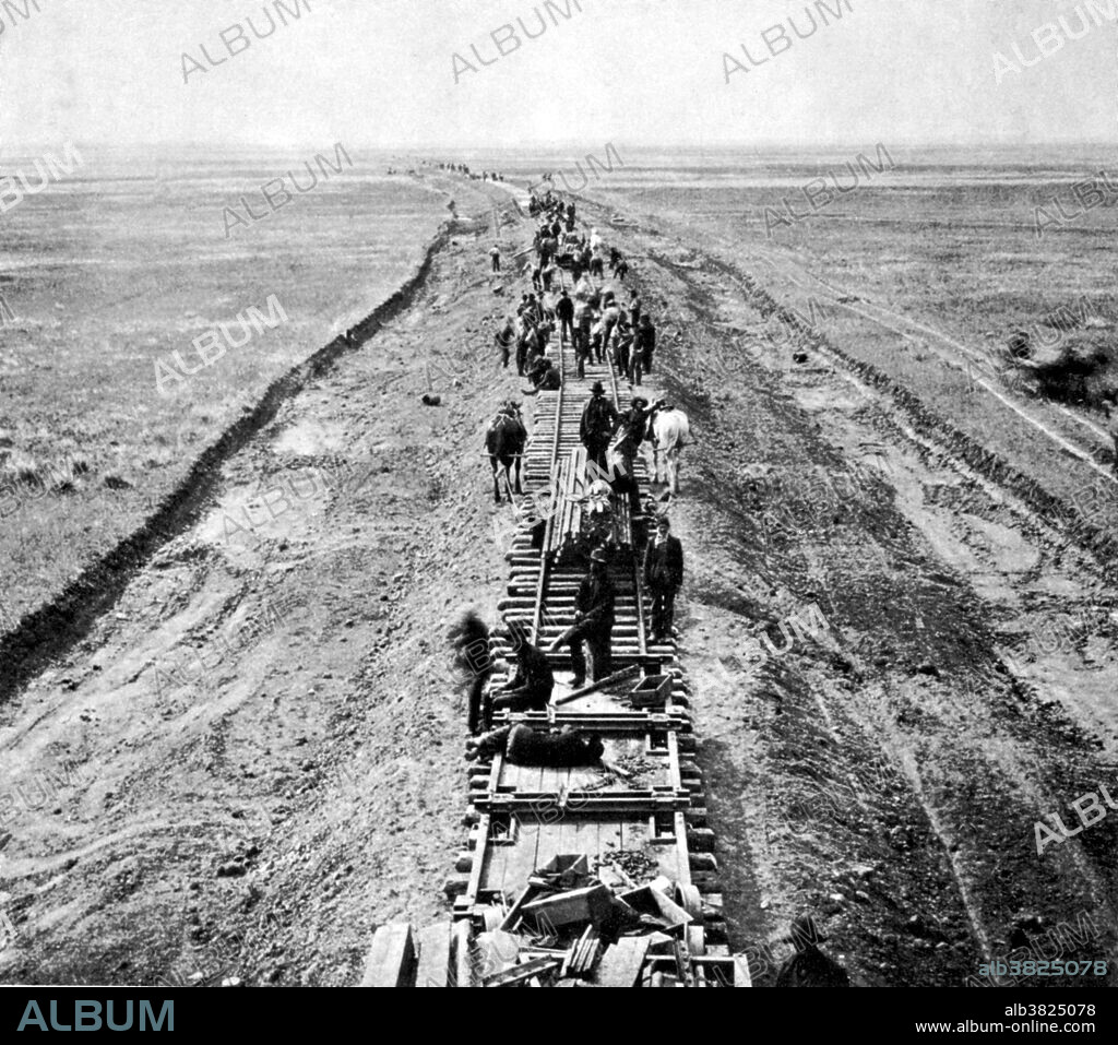 Northern Pacific Railroad laying steel in Montana in 1882-3. The Northern Pacific Railway was a transcontinental railroad that operated across the northern tier of the western United States from Minnesota to the Pacific Coast. It was approved by Congress in 1864 and given nearly 40 million acres of land grants, which it used to raise money in Europe for construction. Construction began in 1870 and the main line opened all the way from the Great Lakes to the Pacific when former president Ulysses S. Grant drove in the final "golden spike" in western Montana on September 8, 1883. The railroad had about 6800 miles of track and served a large area, including extensive trackage in the states of Idaho, Minnesota, Montana, North Dakota, Oregon, Washington and Wisconsin. The main activities were shipping wheat and other farm products, cattle, timber and minerals; bringing in consumer goods, transporting passengers; and selling land. It had a tumultuous financial history, and in 1970 it merged with other lines to form the Burlington Northern Railroad.