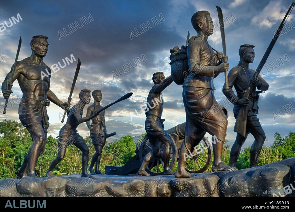 Thailand: The Thalang Victory Memorial. Warrior statues at Phuket Historical Park, Thalang, Phuket, depicting the victory of the people of Phuket over the invading Burmese, 1785-6. Rama I's Chakri dynasty met its first great test in the massive Burmese invasion of 1785. King Bodawpaya of Burma (1745-1819) sent more than 100,000 troops in five armies against Siam. The Burmese forces that invaded southern Thailand enjoyed initial success but were halted at Thalang, in central Phuket, by the bravery of the local defenders. Two sisters, Chan and Muk, the widow and sister-in-law of the late governor, organised the resistance.