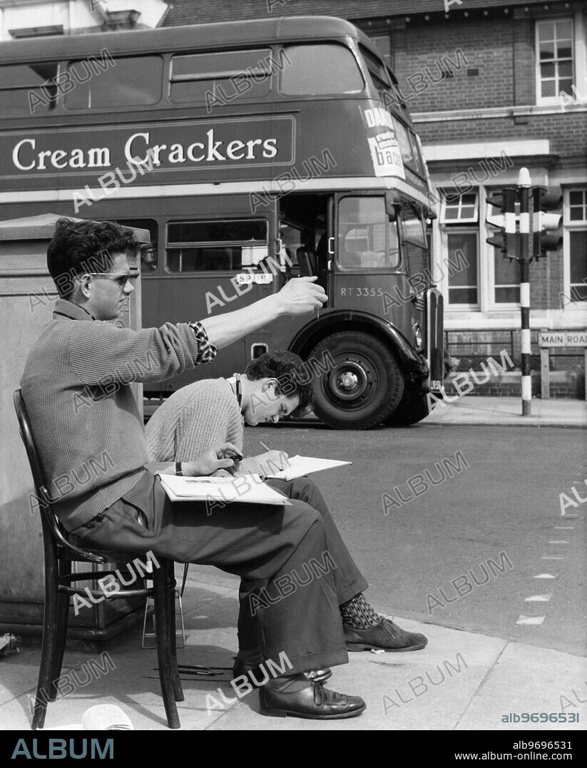 Michael Lamb of Tunbridge Wells and Roger Kennedy of Sidcup Sketch the streetscene before them. 1959.