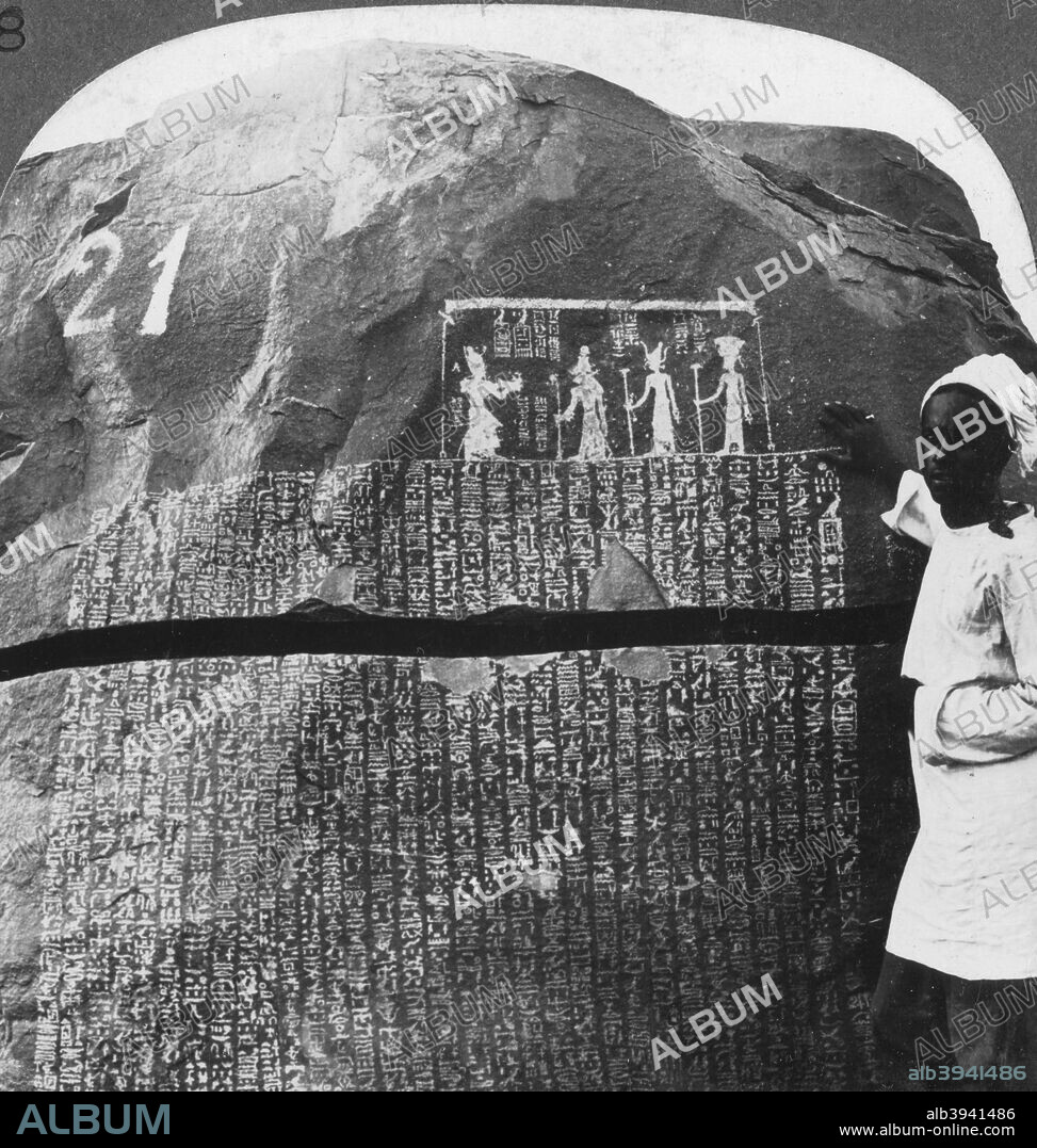 'Remarkable inscription of a Seven Year Famine on an island in the Nile, Egypt', 1905. 'The rocks on these islands are covered with inscriptions. They form the most ancient and most interesting visitor's book in the world. Century after century and dynasty after dynasty from 2600 BC onward through Roman times, kings and nobles, scribes and officers have left their record here.' Stereoscopic card. Detail. From a series called Egypt Through the Stereoscope, text by James H Breasted.