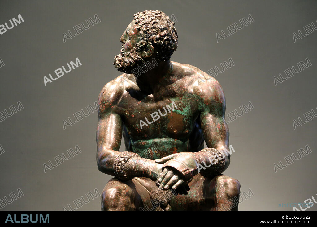 Boxer at Rest. Hellenistic Greek Sculpture. C. 330 BC. Sitting nude boxer at rest, still wearing caestus. National Museum of Rome. Massimo Palace. Italy. Rome.