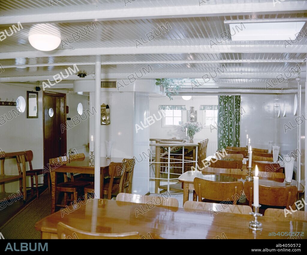 Dining room in the full-rigged ship 'af Chapman', converted into a youth hostel, Stockholm, Sweden. The ship has served as a youth hostel since 1949, run by the Swedish Tourist Association.