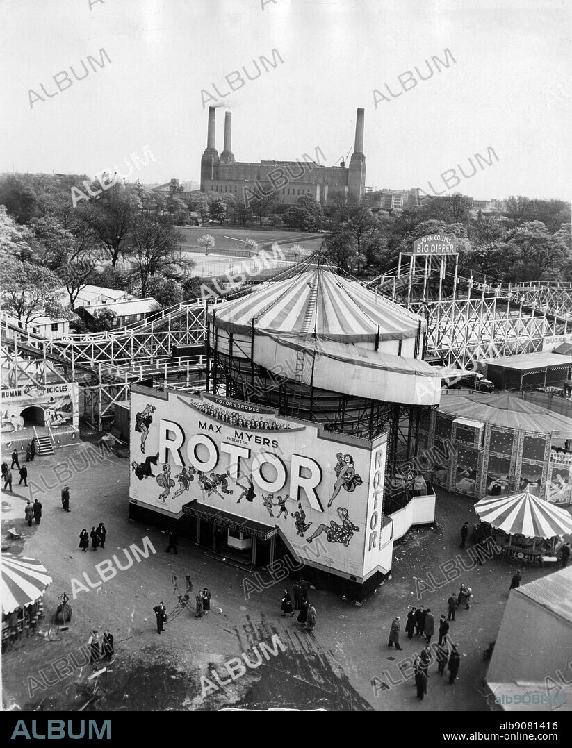 Battersea Park Fun Fair opens for the first time. Battersea Power Station is in the background. London.