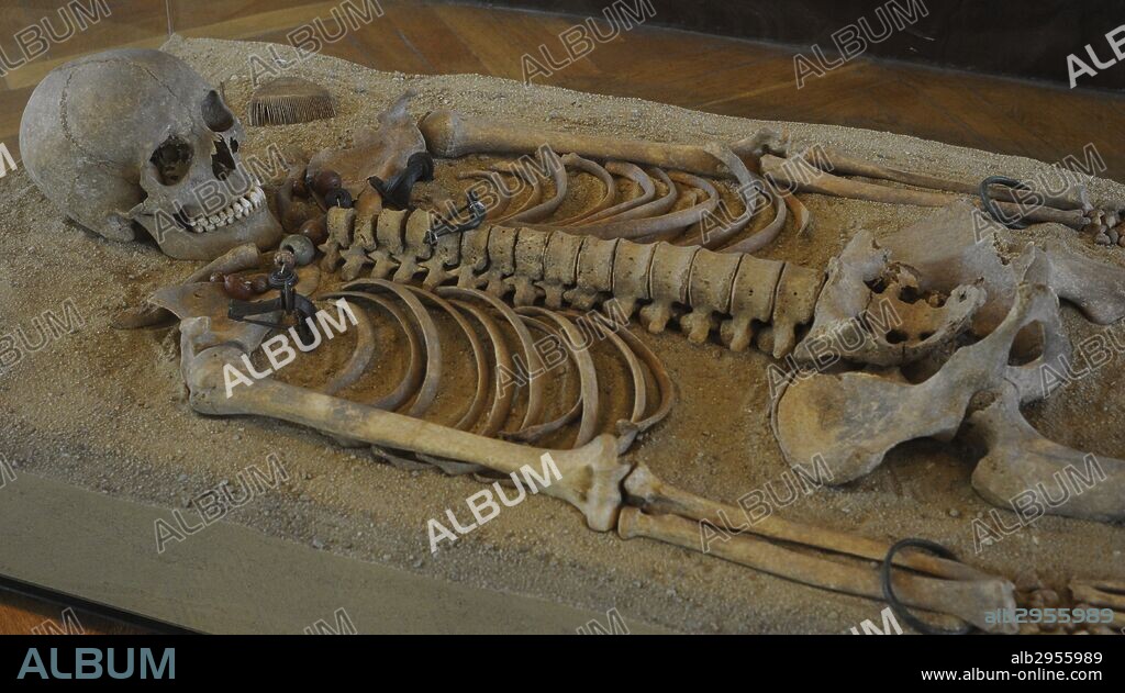Roman era. Tomb with skeleton. Grave goods: Brooch, necklace, belt, buckles, bracelets, hair needle. Pruszcz Gdanski, Poland. 2nd century. Archeological Museum of Gdansk. Poland.