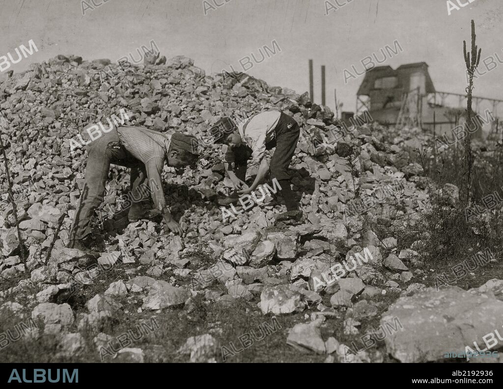 Basil Roberts and James Hopper, both 12 years old, go to school when in session and work at Coleman Bros. Zinc Mine, Aurora, Mo., Saturdays and holidays, culling "waste" from the zinc ore on the "dumps." Their fathers work in zinc mines nearby. These boys told me no boys were permitted to work down in the mines, and said they were the boys working in the vicinity; which seemed to be about true.