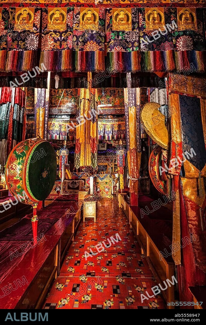 Inside Spituk Gompa Tibetan Buddhist monastery prayer hall with drums, Ladakh, India, Asia.