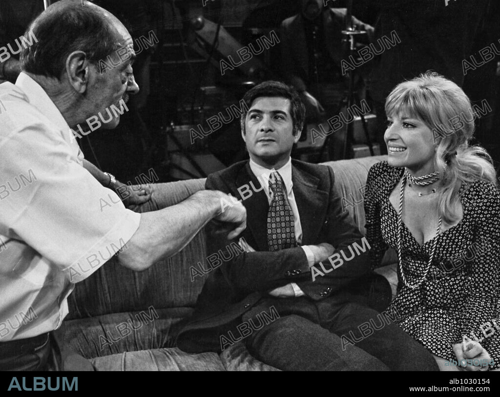 JEAN-CLAUDE BRIALY, LUIS BUNUEL and MONICA VITTI. JEAN-CLAUDE BRIALY, LUIS BUÑUEL and MONICA VITTI in THE PHANTOM OF LIBERTY, 1974 (LE FANTOME DE LA LIBERTE), directed by LUIS BUÑUEL. Copyright GREENWICH/20TH CENTURY FOX.