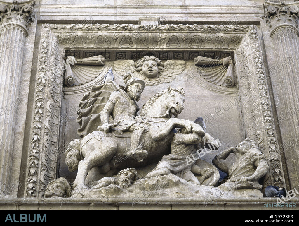 Saint James the Moor-slayer (Santiago Matamoros) on horseback, wearing as soldier and victorious over the infidels. High relief on the upper part of the lateral doorway of the Church of Santiago. Temple built between 1553 and 1559 by the architect Juan de Orea. Almería. Andalusia. Spain.