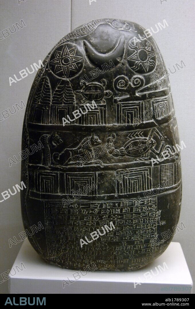 Mesopotamian Art.  Kassite Dynasty. The Eanna-shum-iddina kudurru (1125-1100 B.C.). It describes the land grant made by Governor Eanna-shum-iddina to Gula-Eresh witnessed by his surveyor Amurru-Bel-Zeri. The bottom is inscribed in cuneiform script and at the top are depicted gods and zodiac signs in relief. British Museum. London. United Kingdom.